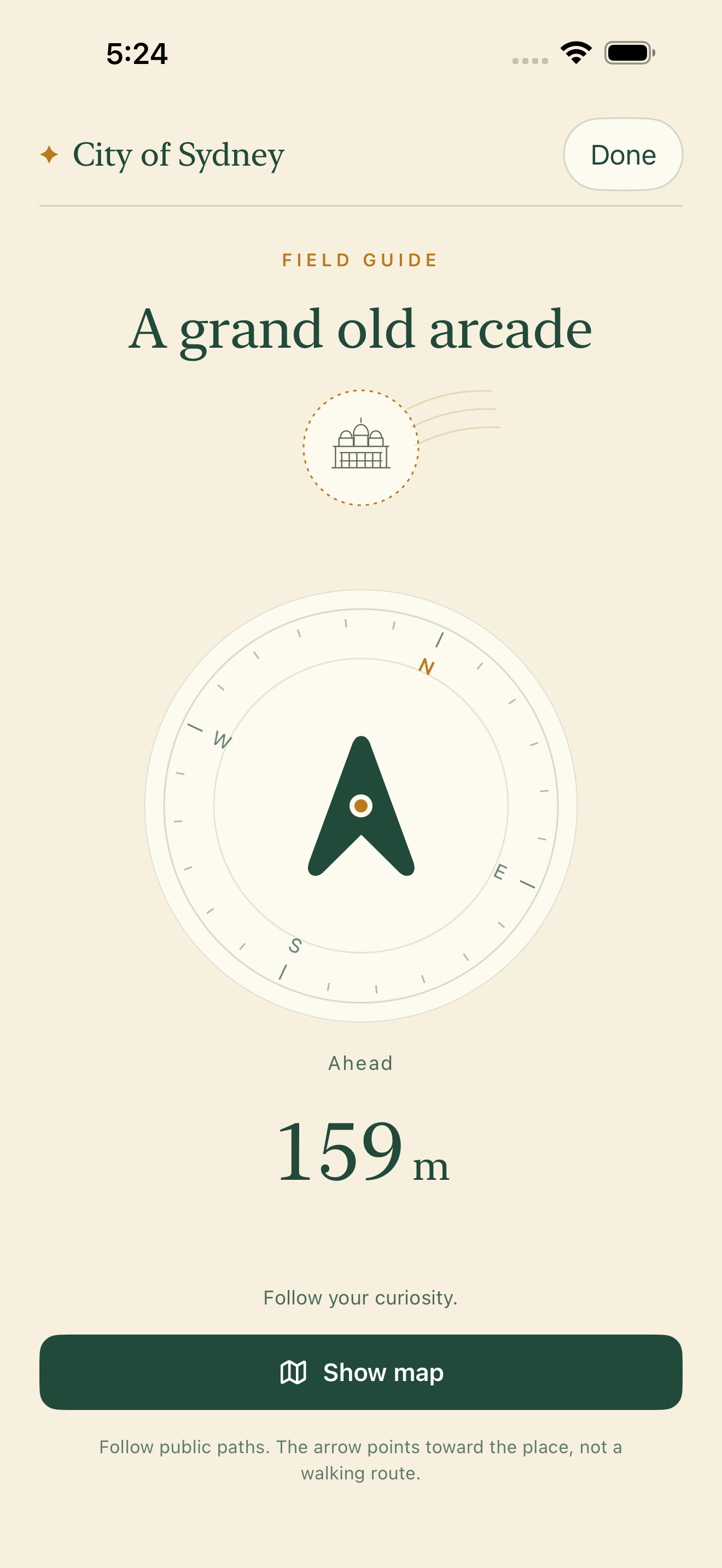 Genuine native iPhone Guide screen with a compass arrow toward Queen Victoria Building, 159 metres away from an example position.